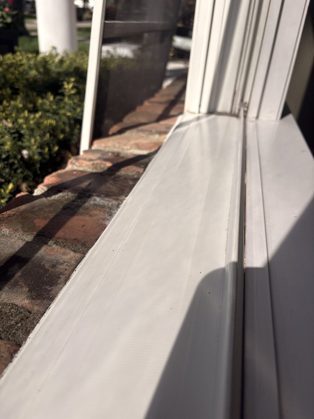 Clean window sill and track after Jubilee Window Washing cleaning